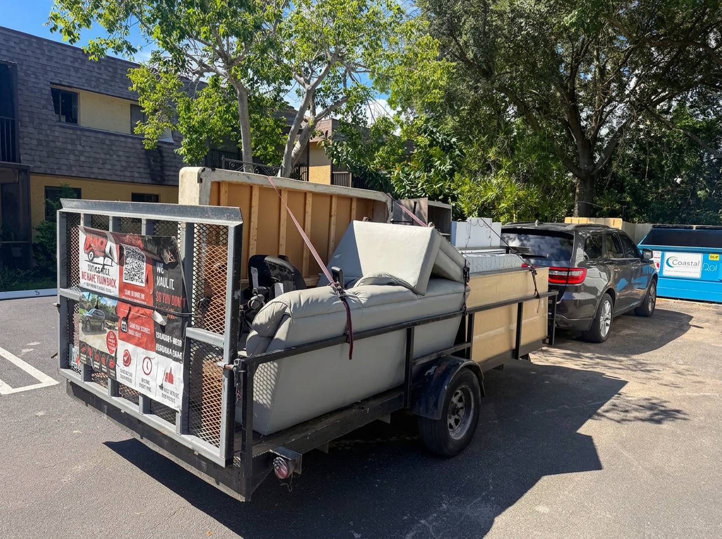 Haul Away Dynamics style crew loading furniture into a trailer in South Florida